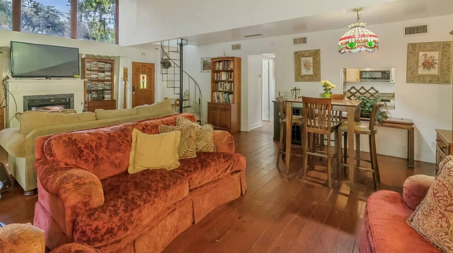 Living Room is large with lots of comfy couches. The tv comes with a dvd player & Chromecast. An adjacent private deck with sunloungers and additional dining is located thru the sliding doors.