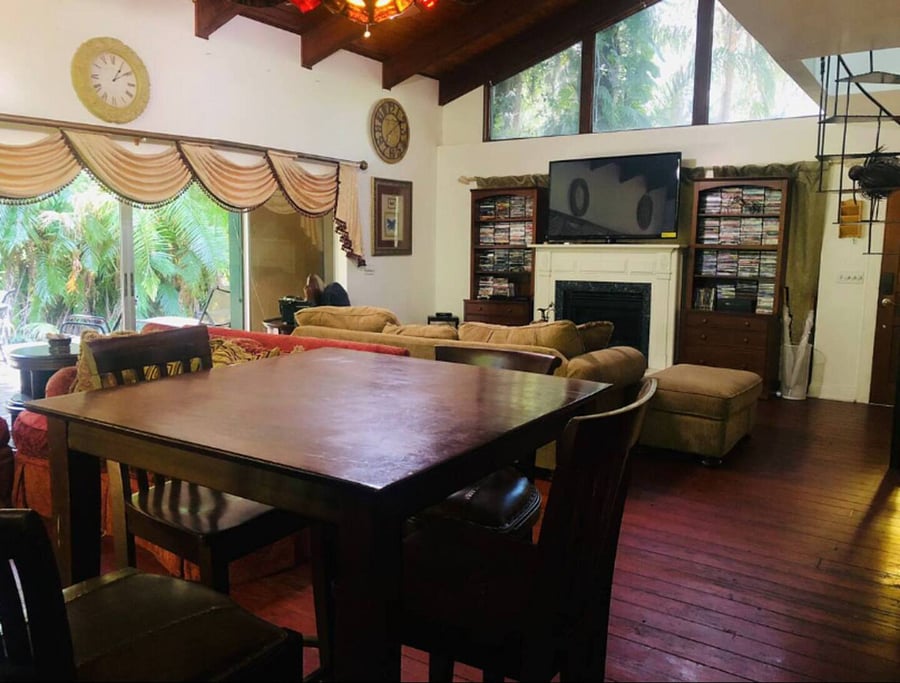 The living room has a 4 person high top dining table adjacent to the kitchen. In addition there is a dining table for 4 on the private deck through the sliding glass doors.