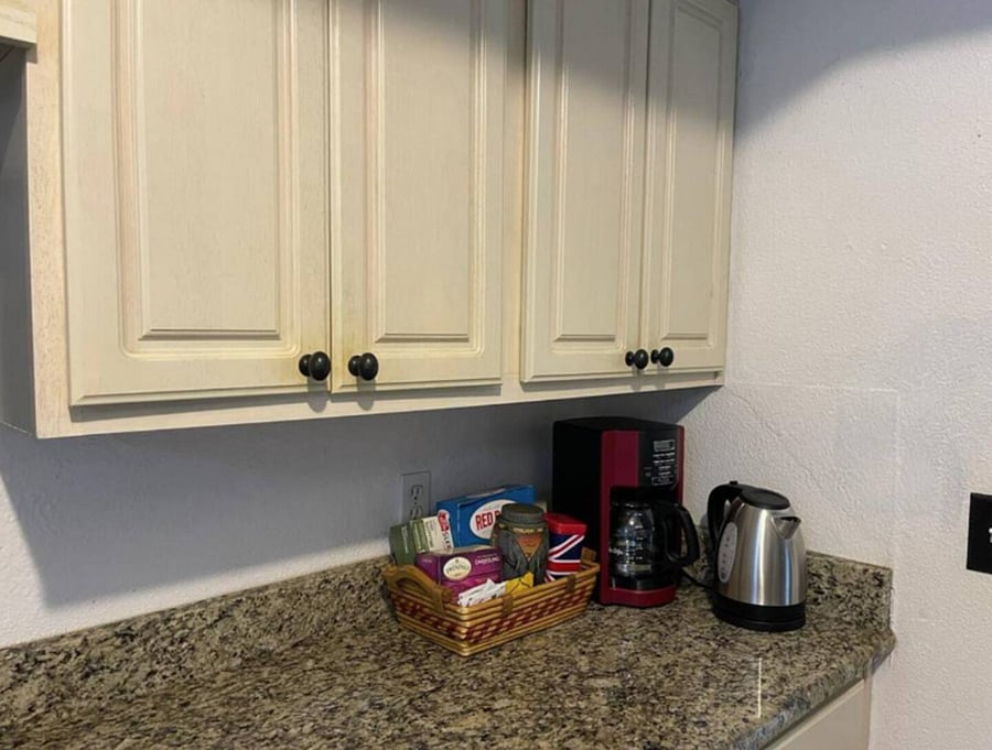 A coffee/tea station has been set up for you in the kitchen. This includes a drip coffee maker and an electric kettle.