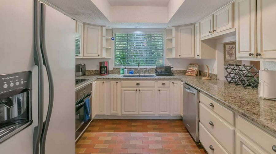 The full kitchen has a dishwasher, oven, stove top, microwave & refrigerator. A Brita water jug in the fridge and a countertop ice maker. It is fully stocked with pans, glassware, dishware & utensils.