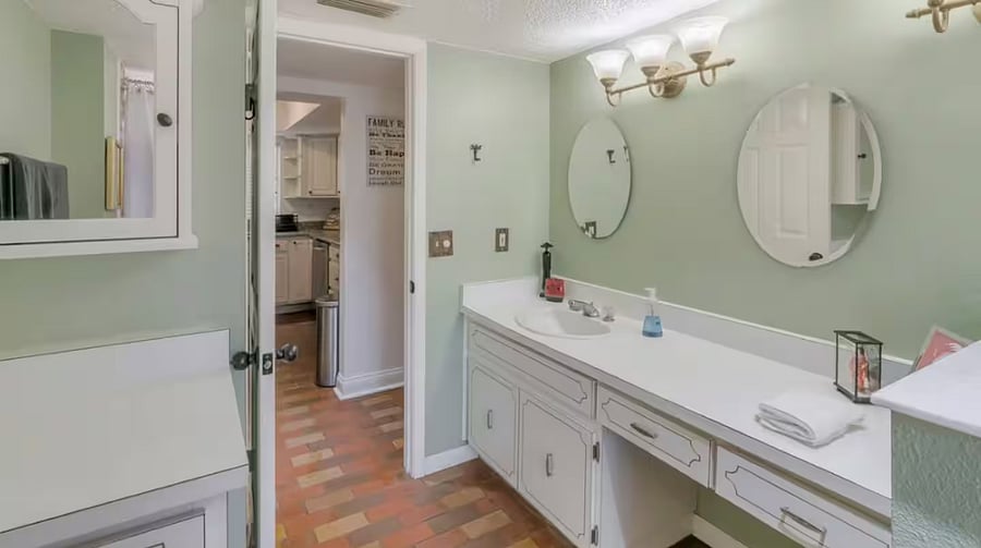 The full bathroom on the ground floor unit consists of a sink, large counter top, toilet and whirlpool tub with shower. Towels, shampoo, conditioner and soap are provided.