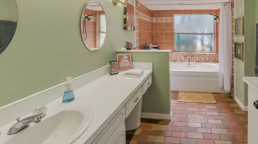 The full bathroom on the ground floor unit consists of a sink, large counter top, toilet and whirlpool tub with shower. Towels, shampoo, conditioner and soap are provided.