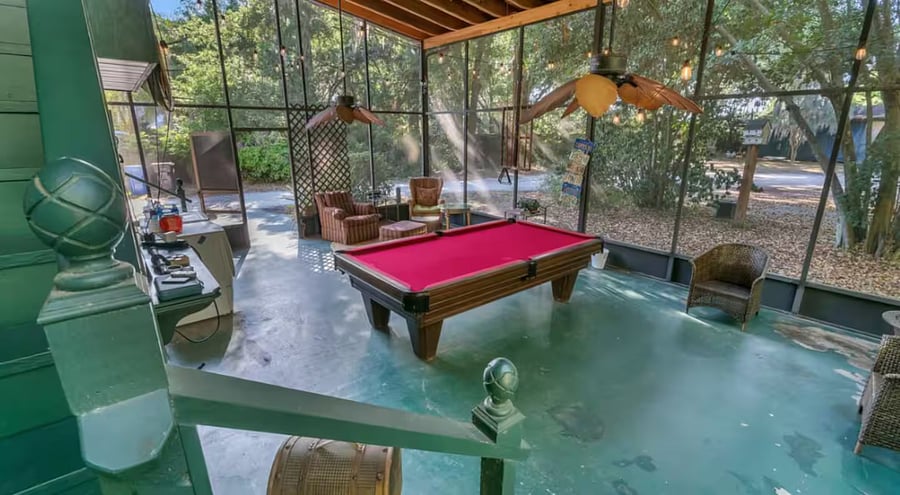 Our large screened patio has a full size pool table, seating, bistro lights, small portable BBQ & a washer & dryer.