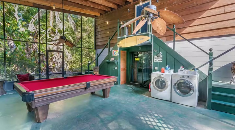 Our large screened patio has a full size pool table, seating, bistro lights, small portable BBQ & a washer & dryer.