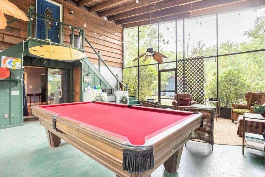 Our large screened patio has a full size pool table, seating, bistro lights, small portable BBQ & a washer & dryer.