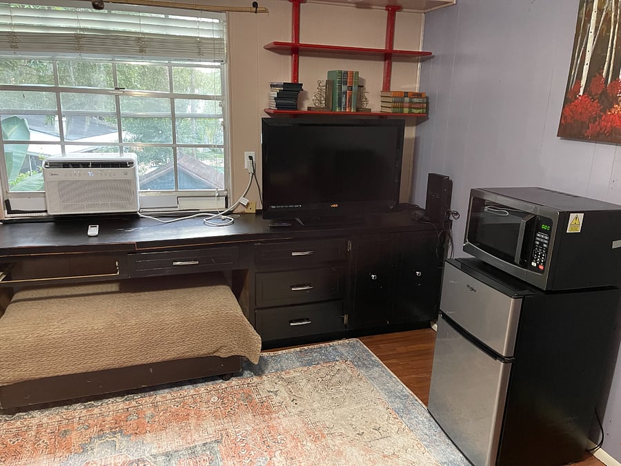 The 4th bedroom can either be configured as a bedroom with a Queen size bed. Or, can be configured as a 2nd living room/Office with a couch, armchair, ottoman & dining table. A mini fridge, microwave and single serve Keurig machine.