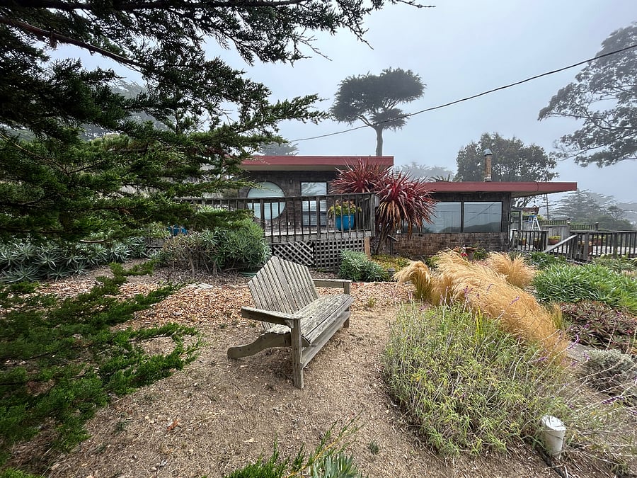 Garden seating area with ocean view.