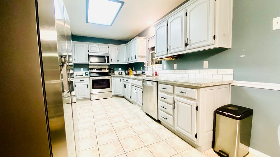 Kitchen with new refrigerate and all kitchen supplies