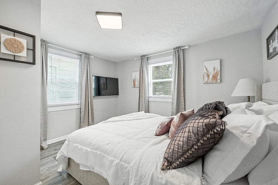 Enjoy a little TV while resting in the comfy Queen Bed