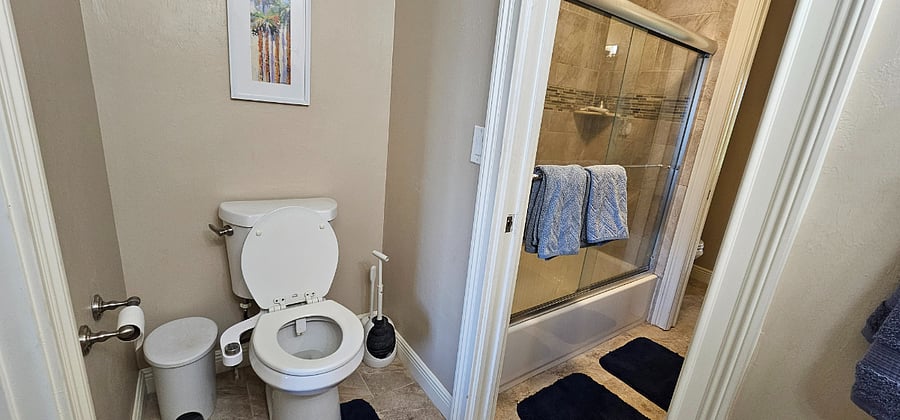 Half bath leading to shared shower.