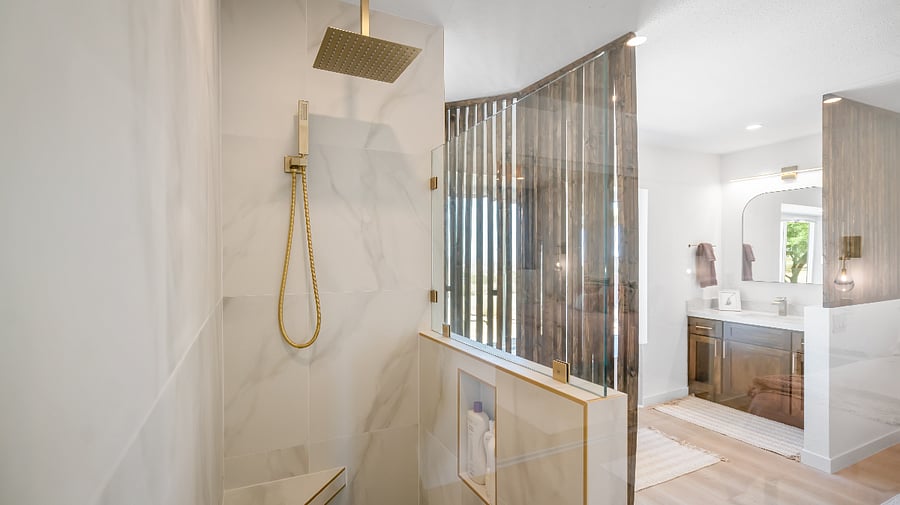 Exquisite finishes in shower and vanity in addition to wood feature walls add privacy.quart
