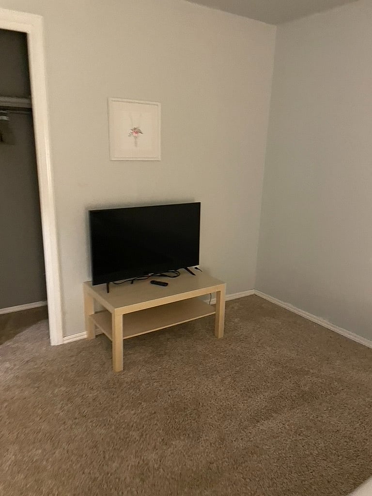 3rd bedroom view of tv from bed