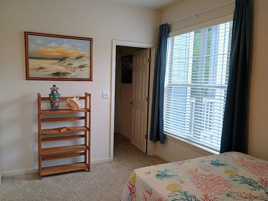Your bedroom has plenty of natural light. There's enough room for a small desk and chair where the bookcase/shelves are under the beach picture. We can discuss when you are in the room.