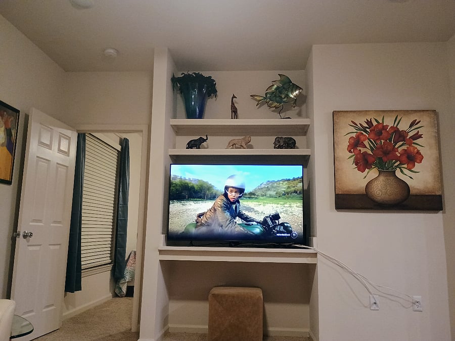 To the left of the TV is your bedroom entrance. You and the roommate are at opposite ends of the apartment.