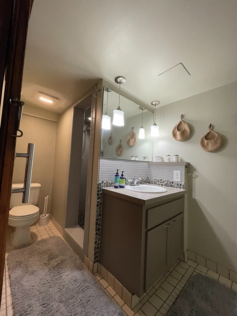 Your private bathroom with custom river rock and tile walk in shower.