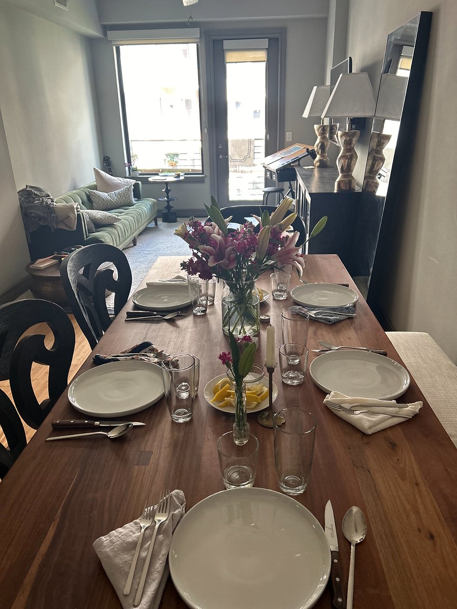 Full dining room table with bench against the wall that can be used if you pull the table out