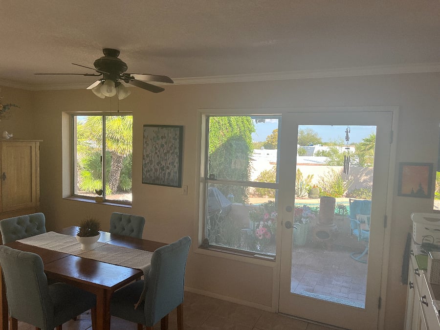 Kitchen table looks out on patio