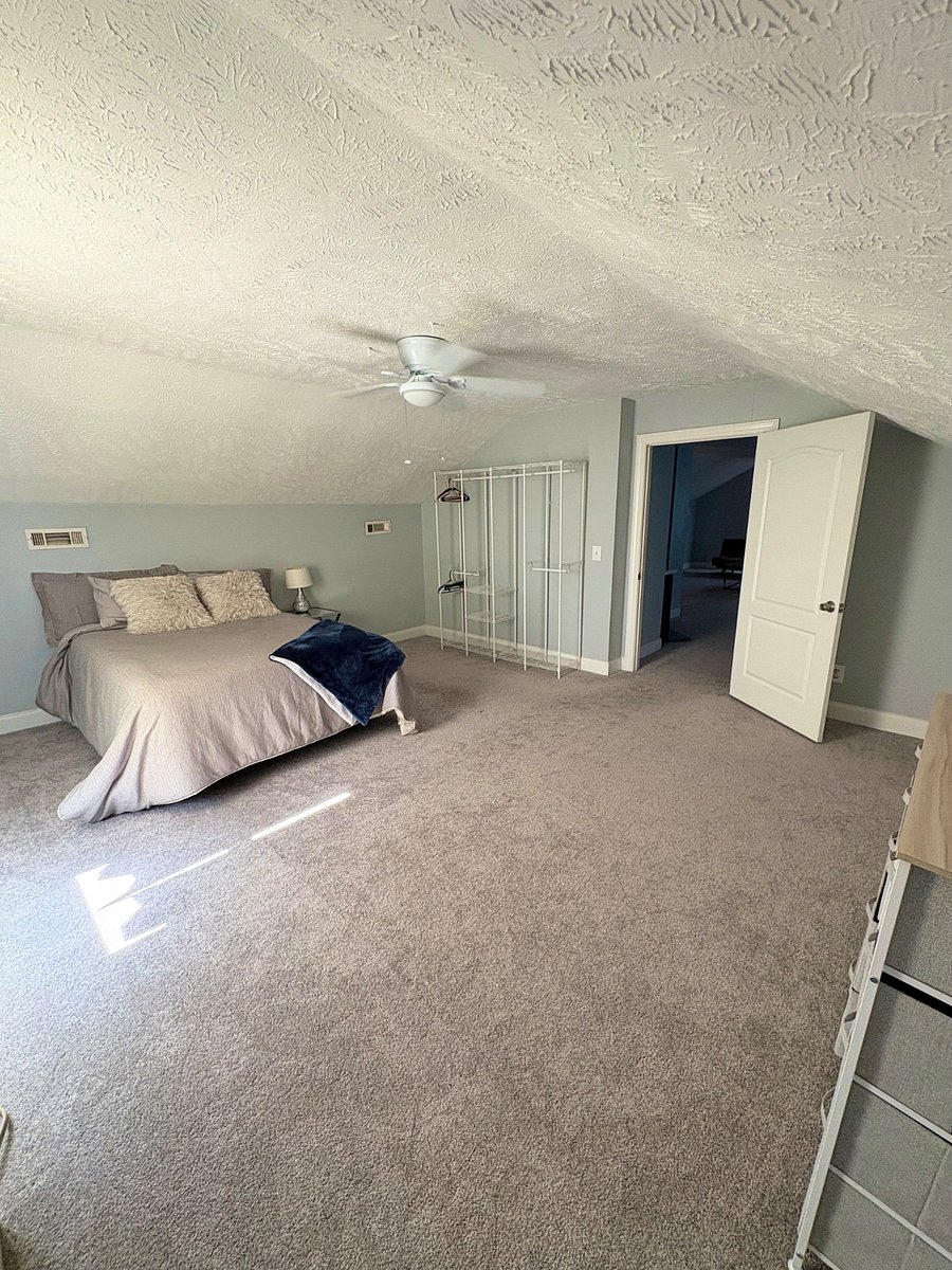 Large bedroom with standing closet and dresser 