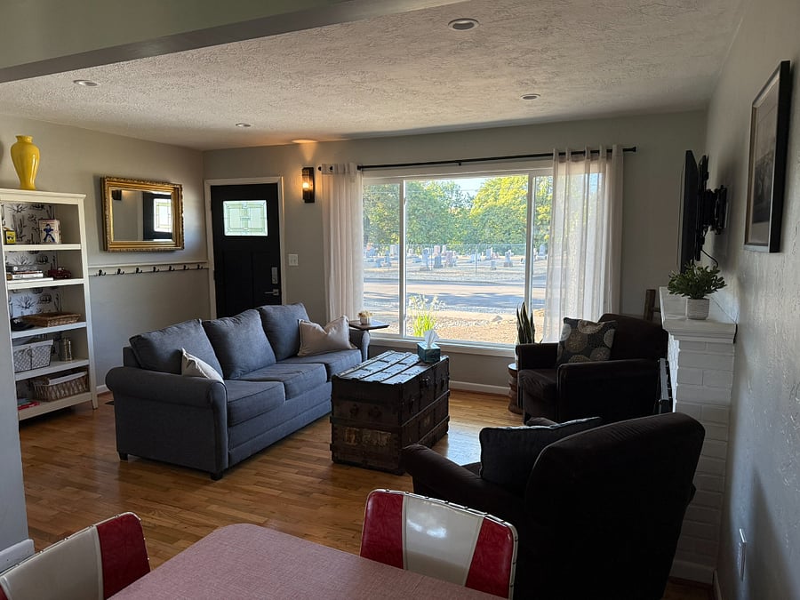 Living room & entryway with plenty of room for coats, hats, bags.