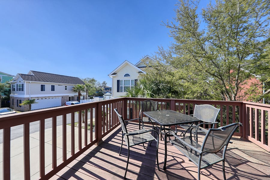 Enjoy al fresco dining with a grill and outdoor seating, perfect for a relaxing evening on the balcony.