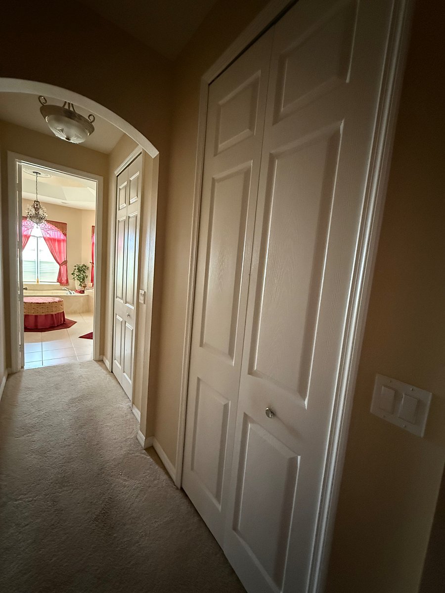 Master bedroom hallway with two large walk in closets
