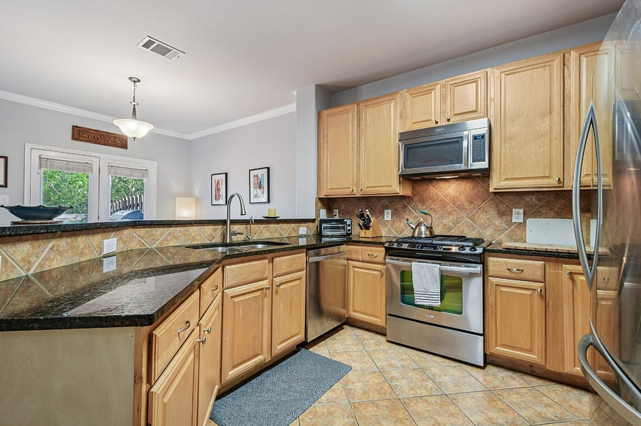 Spacious kitchen with many appliances