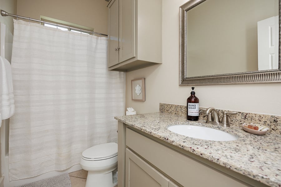 Guest bathroom with tub/shower.