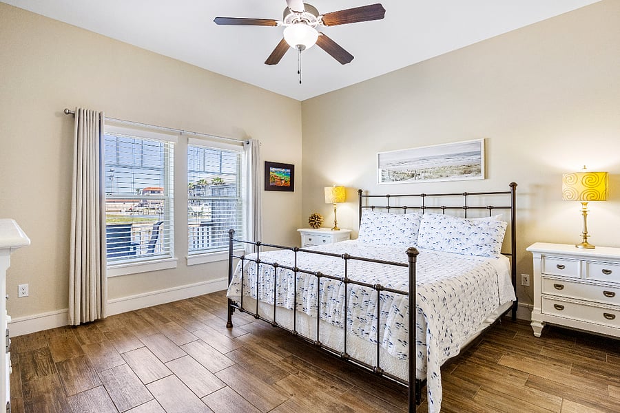 Primary bedroom with king bed, blackout shades and water view!