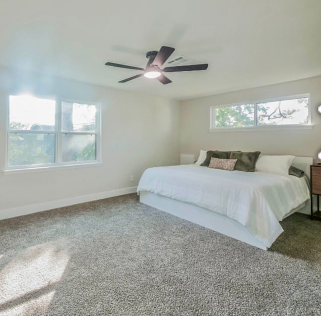 Spacious bedroom with king bed and en suite bath 