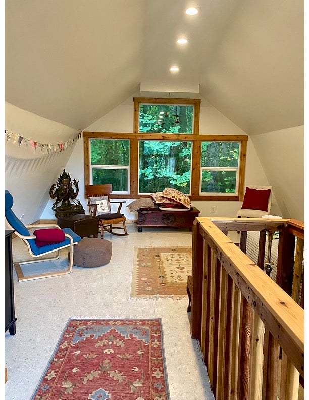 sleeping loft with view of forest
