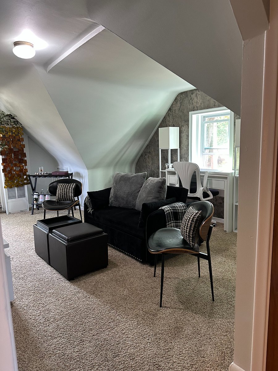 When you reach the top of the stairs, there is a comfortable living room with a sleeper sofa, 50" SMART tv, electronic fireplace, extra seating, and a dedicated workspace.  New furniture, or very gently used.