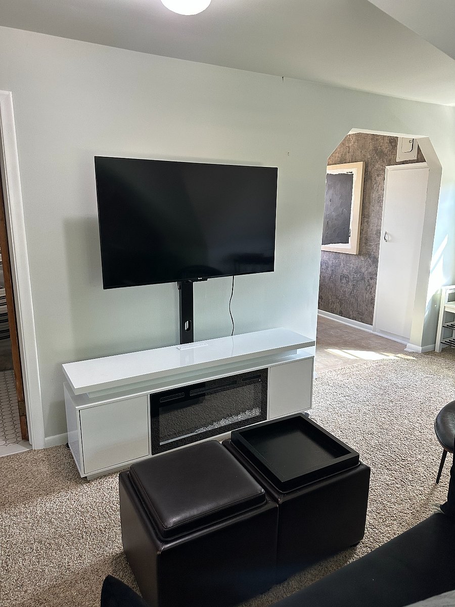 Enjoy cozy nights watching television on the large screen smart ROKU television with an electronic fireplace.  Fireplace offers heat, colorful lighting, storage, and a cozy vibe.