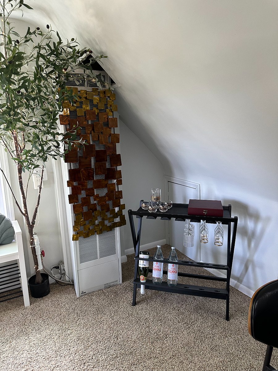 It may be a cozy little space but there is room to entertain a guest or two.  Enjoy a beverage from your portable wine bar complete with beautiful vintage glassware.