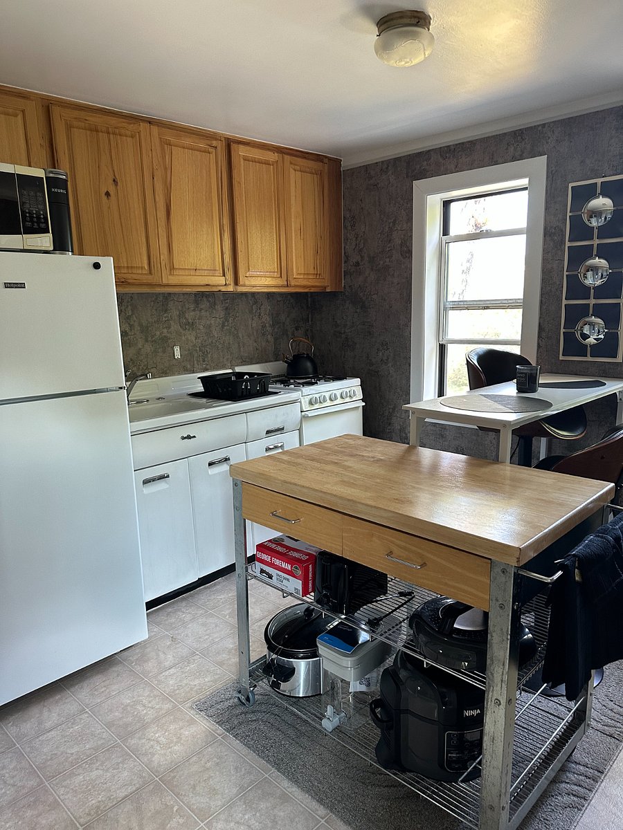 The kitchen offers a stove, refrigerator, microwave, Kuerig coffee maker, air fryer, George Foreman grill, Brita water filter, crockpot, and all the essentials you'll need.
