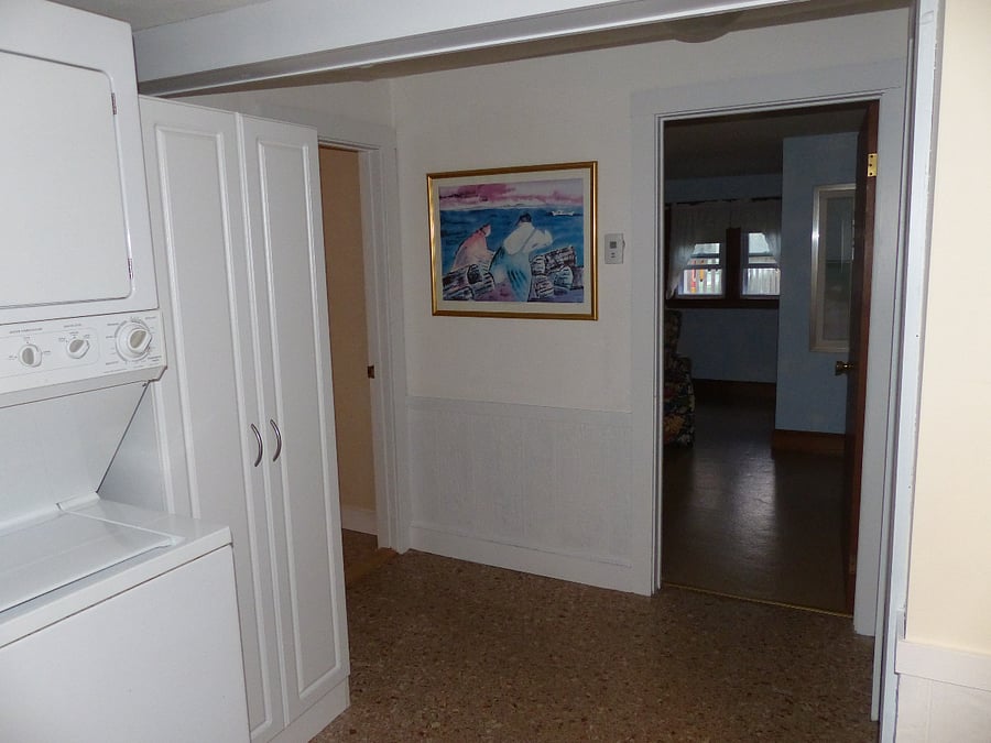 Hallway leading to bathroom and bedrooms.