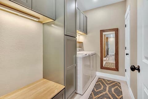 Builder-grade basic laundry? Not a vibe. This laundry room is super functional and the perfect launch pad to sit and put on your shoes and collect yourself before leaving for an adventure.