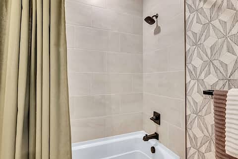 Spacious secondary bathroom with shower/tub combo--linens provided, Ample drawer space, under-cabinet organizer, back-of-door toiletry organizer.