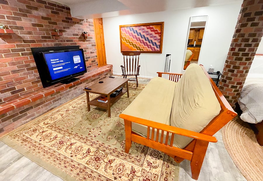 Relax on the futon and stream your favorite shows on the Roku TV