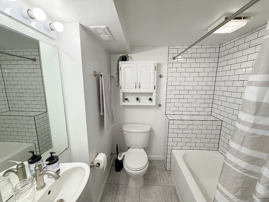 Enjoy a hot shower or take a soak in the tub. Check out the cabinet for a variety of toiletries.