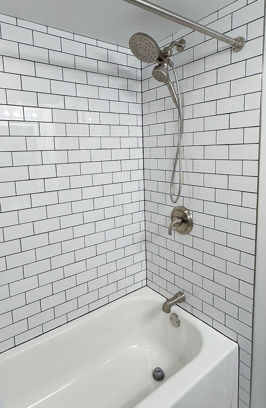 Bathtub with multi-functional shower head and hand wand