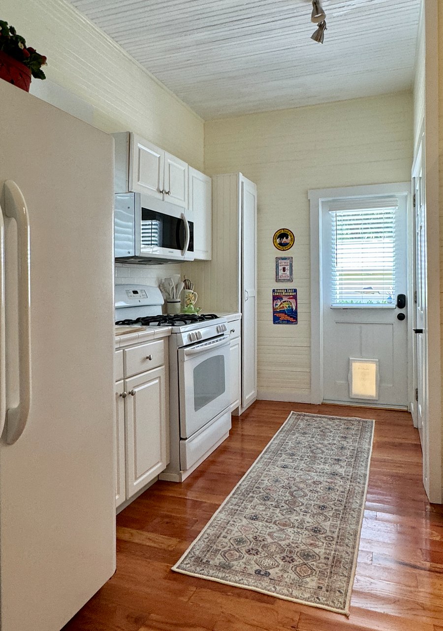 Full kitchen with modern appliances, stocked with high-quality cookware, bakeware, flatware, serving pieces, chef's knives, and all the essentials you need to prepare full meals or simple snacks.