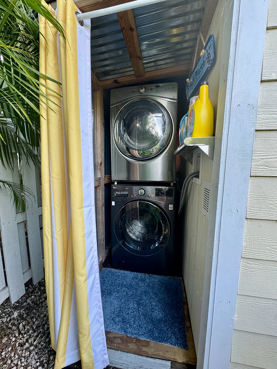 Laundry shed with full-sized washer and dryer.