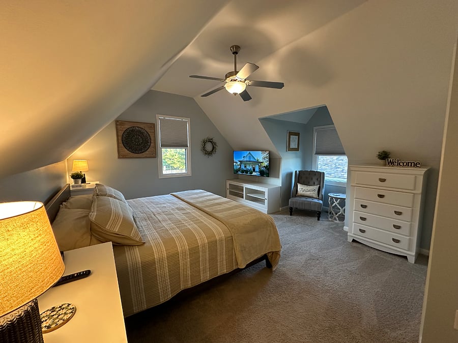 King bedroom with high end mattress, 50 smart tv, dresser and closet.