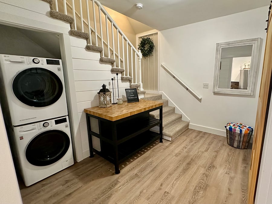Laundry area with starter laundry pods and towels for the hot tub.