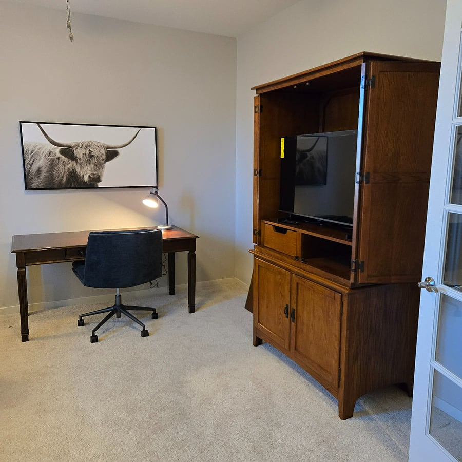 Desk area with a comfortable , adjustable swivel chair - for working, or gaming.