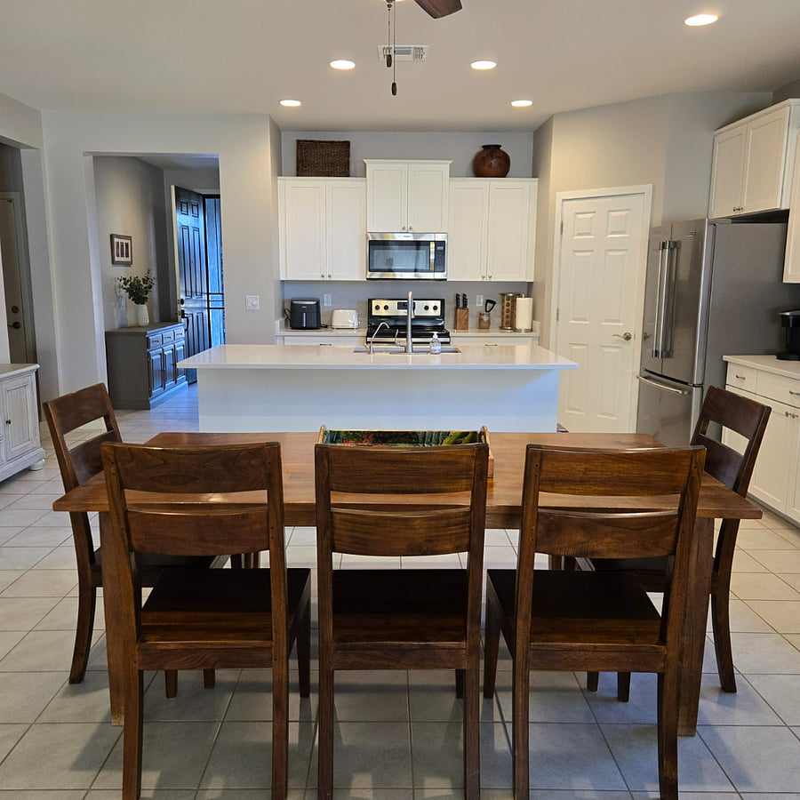 Large island kitchen opens to dining and living room for Great Room living.