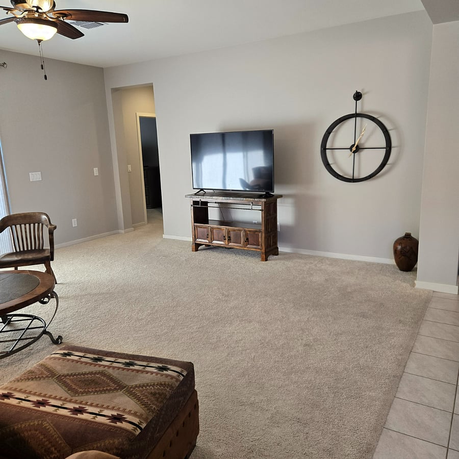Large, spacious living room with smart TV.