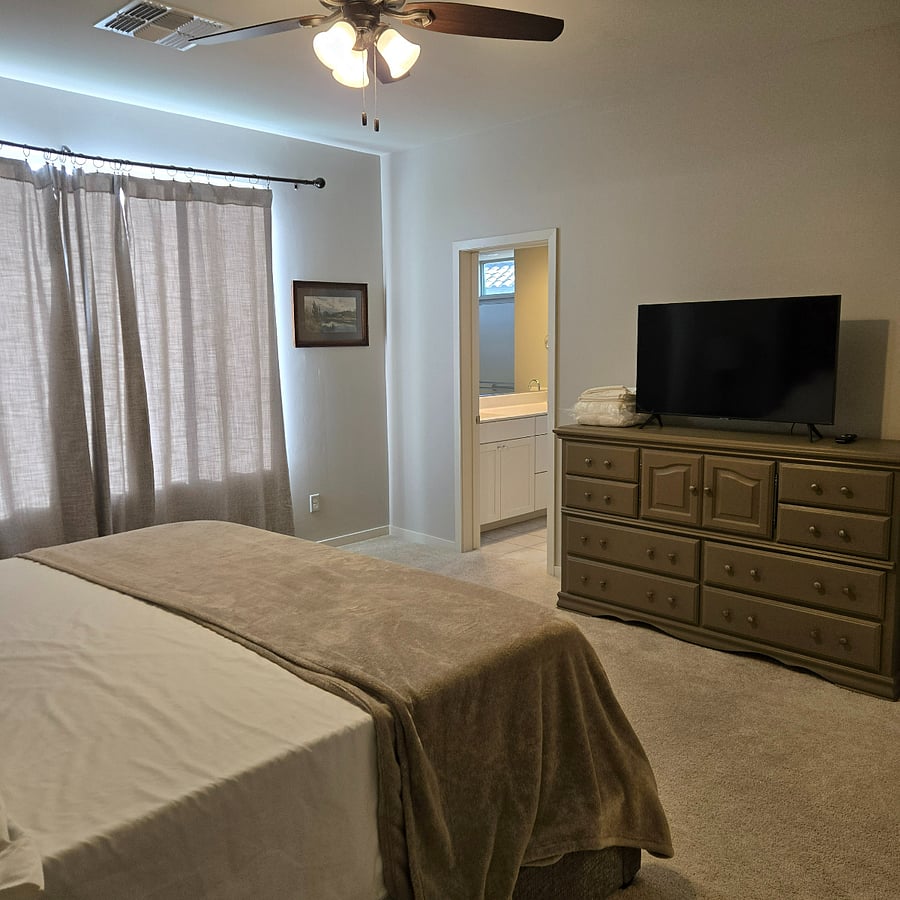 Primary suite has a private bath with oversized shower, dual sinks and a walk-in closet with dresser.