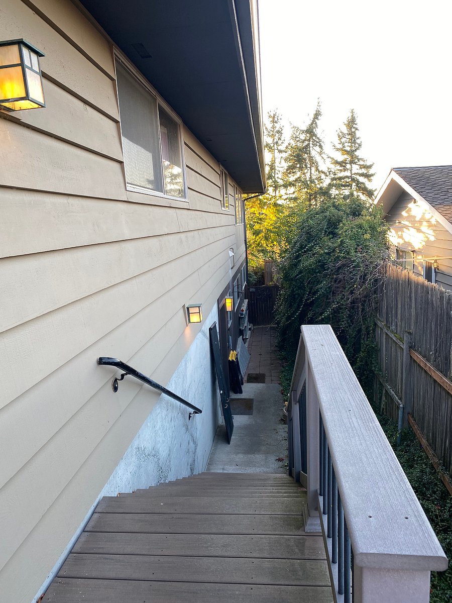 Well lit stairs from driveway parking to apartment