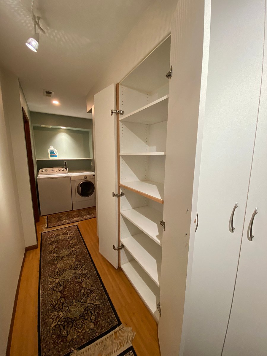 Storage cabinets begin in laundry area and end down the hall. LOTS of place to store things.